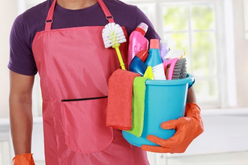 Carpet cleaning team preparing equipment safely